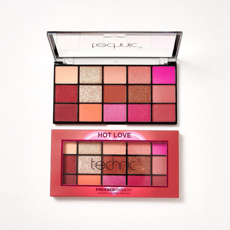 2 Hot Love palettes on a white background. 1 is in its original packaging which is red and has a heart outline in the middle on the front, and the other is out of the packaging.