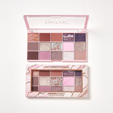 2 unconditional eyeshadow palettes on a white background. 1 is in its light pink box with gold patterns on it and the other is opened and out of the packaging.