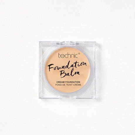A foundation balm in the shade Oat Milk on a white background. 