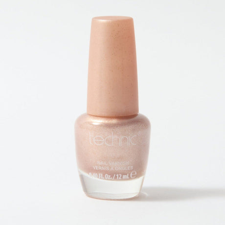 A bottle of shimmer nail varnish in the shade Seashell on a white background