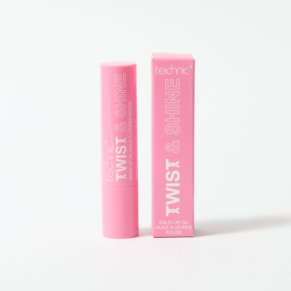 A twist and shine lip oil in the shade Pink Sparkle on a white background with the box packaging next to the product.