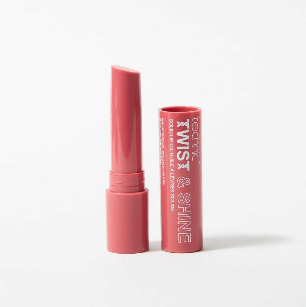 An opened twist and shine lip oil in the shade Rosy Glow on a white background.