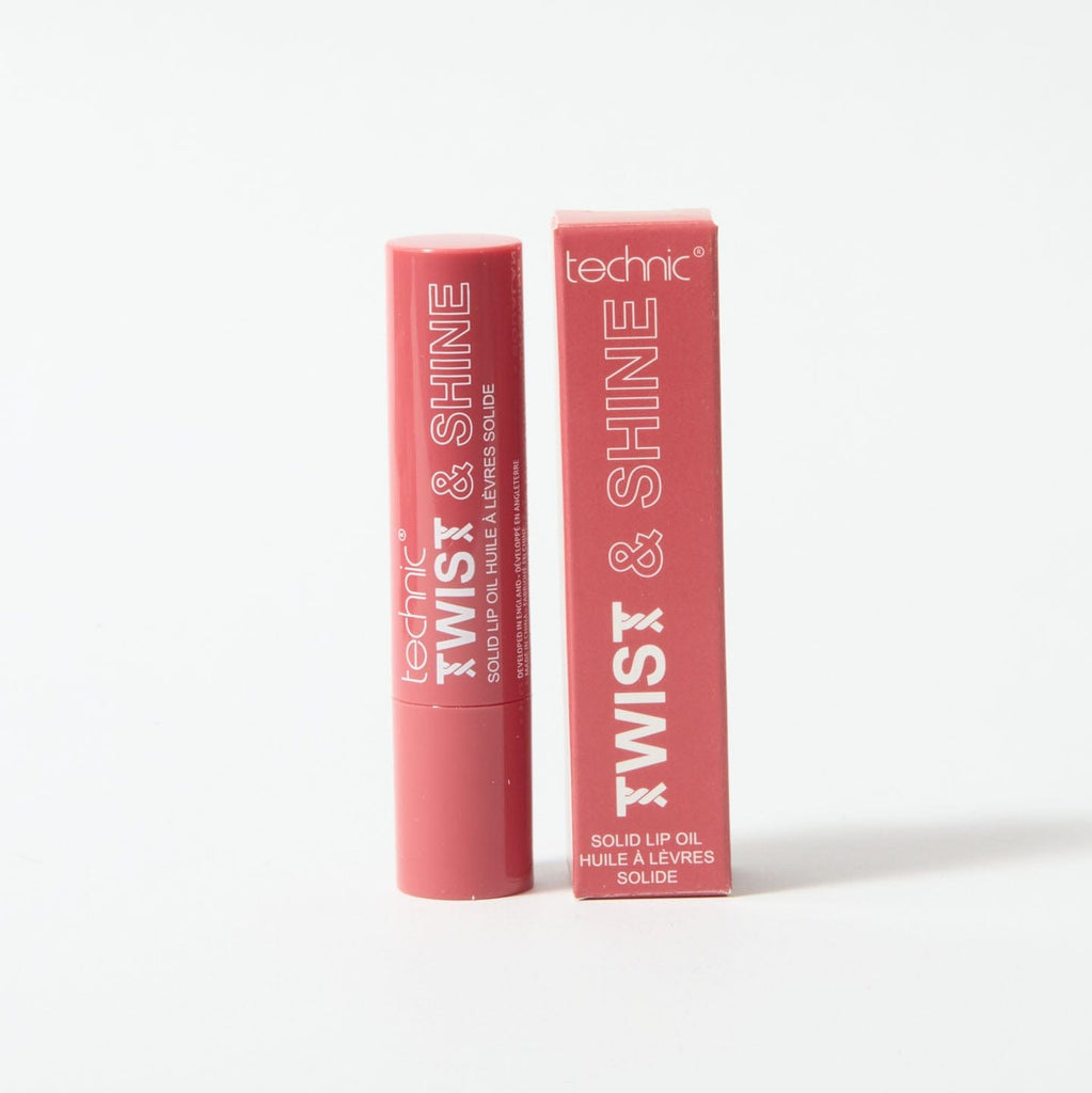 A twist and shine lip oil in the shade Rosy Glow on a white background with the box packaging next to the product.