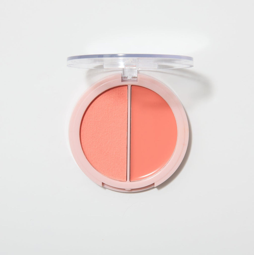 An opened coupled up blusher in the shade Tropical Romance on a white background.