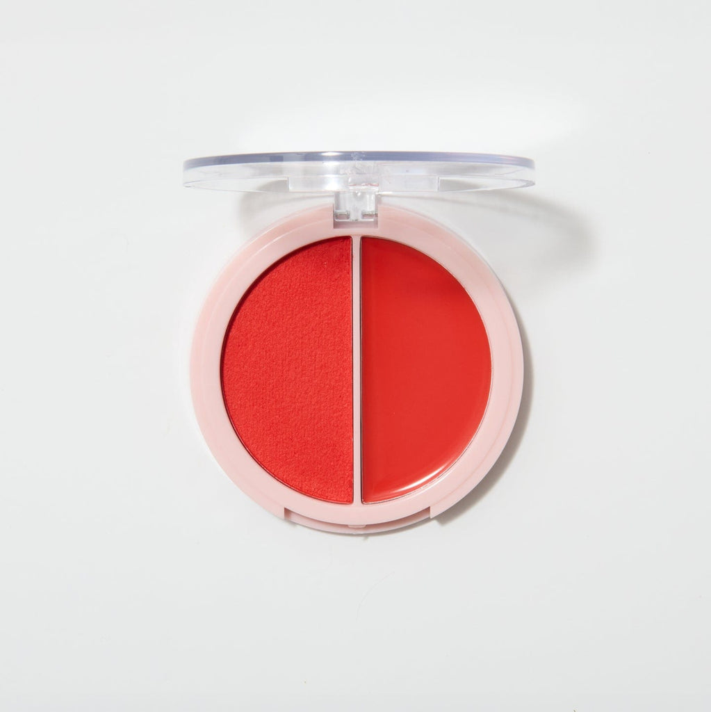 An opened coupled up blusher in the shade Twin Flame on a white background.