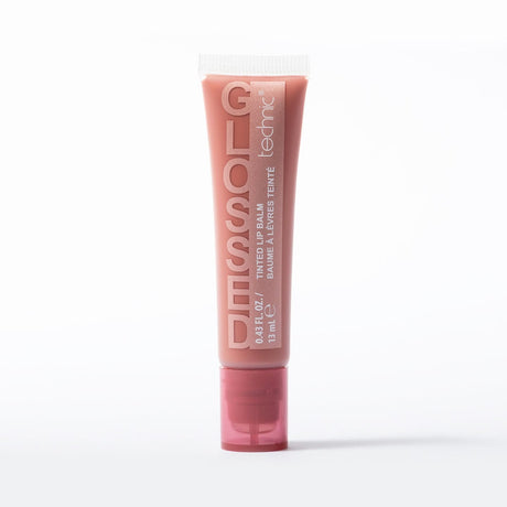 A squeeze tube of Technic Glossed lip balm in shade Toffee, standing upright on a clean white background.