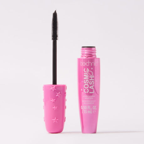 A pink tube of Cosmic Lash Mascara stands next to its matching pink cap with embossed stars, with the black mascara wand lifted out, on a clean white background.
