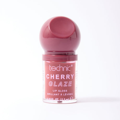 A bottle of Technic Cherry Glaze lip gloss with a glossy dark pink cap and a clear container showing the pink gloss inside, set against a plain white background.