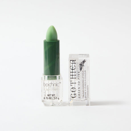 Gothica opened colouring changing lip balm in the colour green, on a white background.