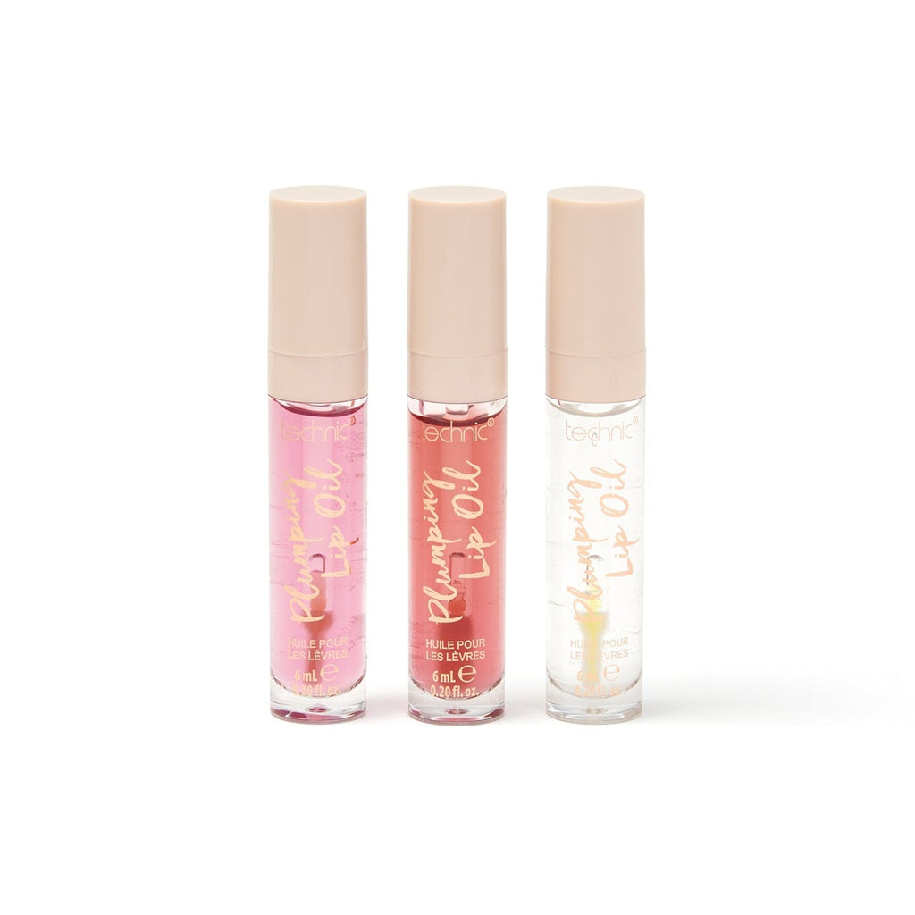 The 3 plumping lip oils out of the giftset packaging on a white background.