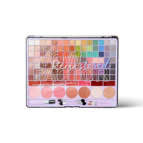 A makeup palette labelled 'WOW Factor Remastered' with multiple colour pans and three small applicators, photographed on a clean white background.