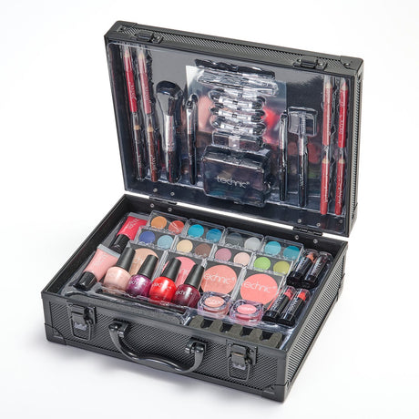 An open black textured makeup case filled with cosmetics, including lipsticks, eyeshadows, blushes, nail polishes, and brushes, on a white background.