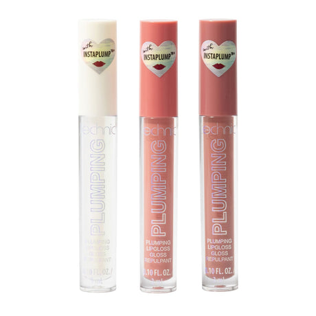 Three Technic Plumping lip gloss tubes in shades of clear, peachy pink, and rosy nude, arranged side-by-side on a white background.