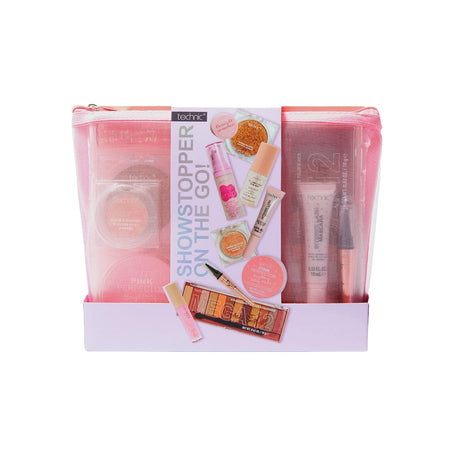 Technic Showstopper On The Go! makeup bag set, featuring a translucent pink zippered pouch with various makeup items inside and printed promotional graphics on the front.