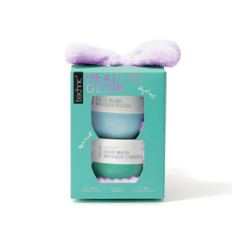 A teal Technic 'Head to Glow' gift set box featuring a lavender plush bow headband on top and a clear window showing two cylindrical masks inside, photographed on a clean white background.