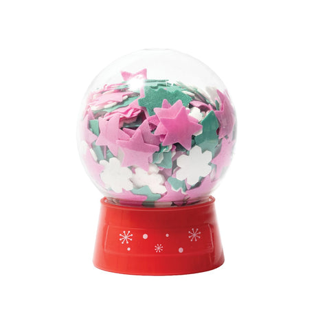 Snow globe filled with bath confetti on white background